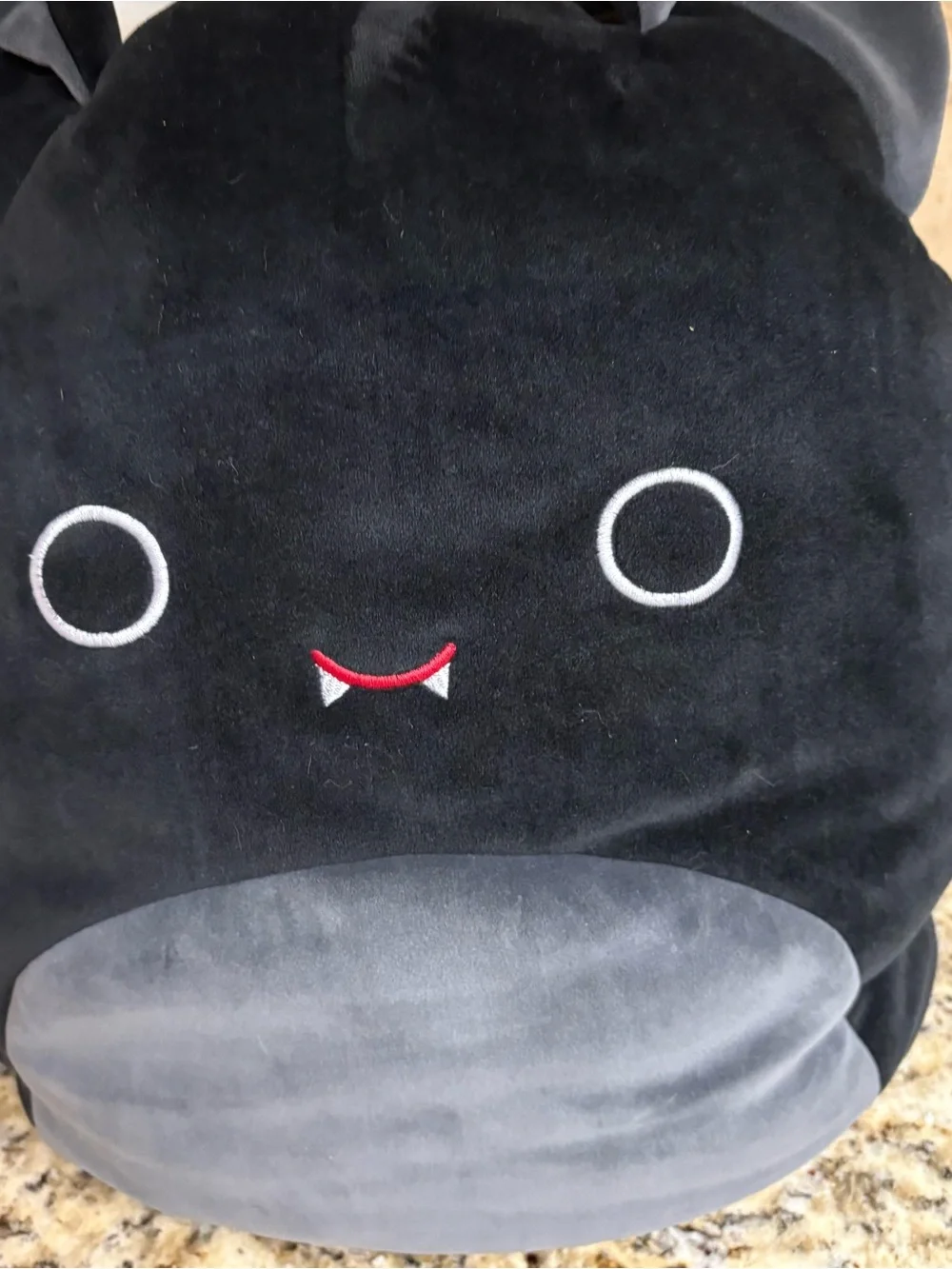 Squishmallows Black Plush Monster Backpack with Gray Belly and Red Smile